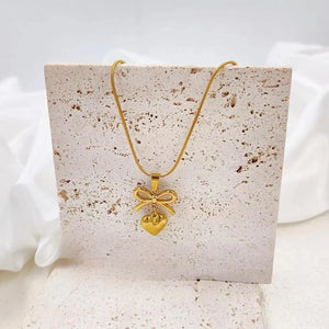 The Gold Ribbon Bow & Heart Pendant Necklace